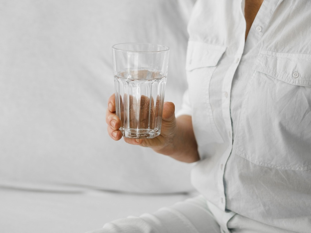 close-up-patient-holding-glass.jpg