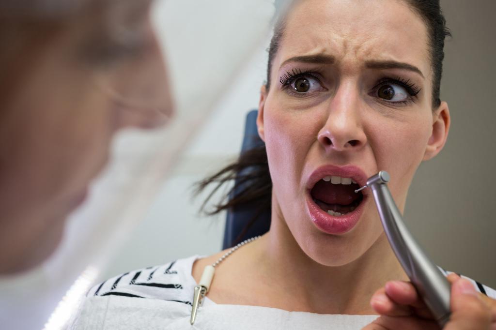 young-woman-scared-during-a-dental-check-up.jpg