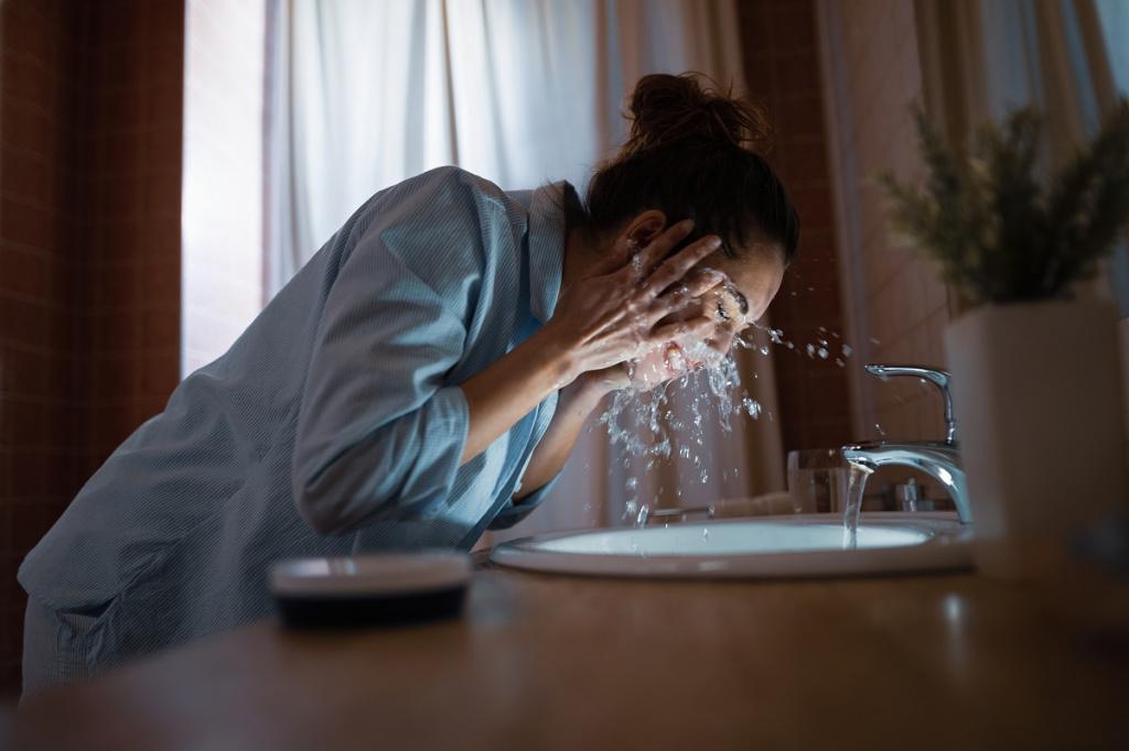young-woman-cleaning-her-face-with-water-in-the-bathroom.jpg young-woman-cleaning-her-face-with-water-in-the-bathroom.jpg