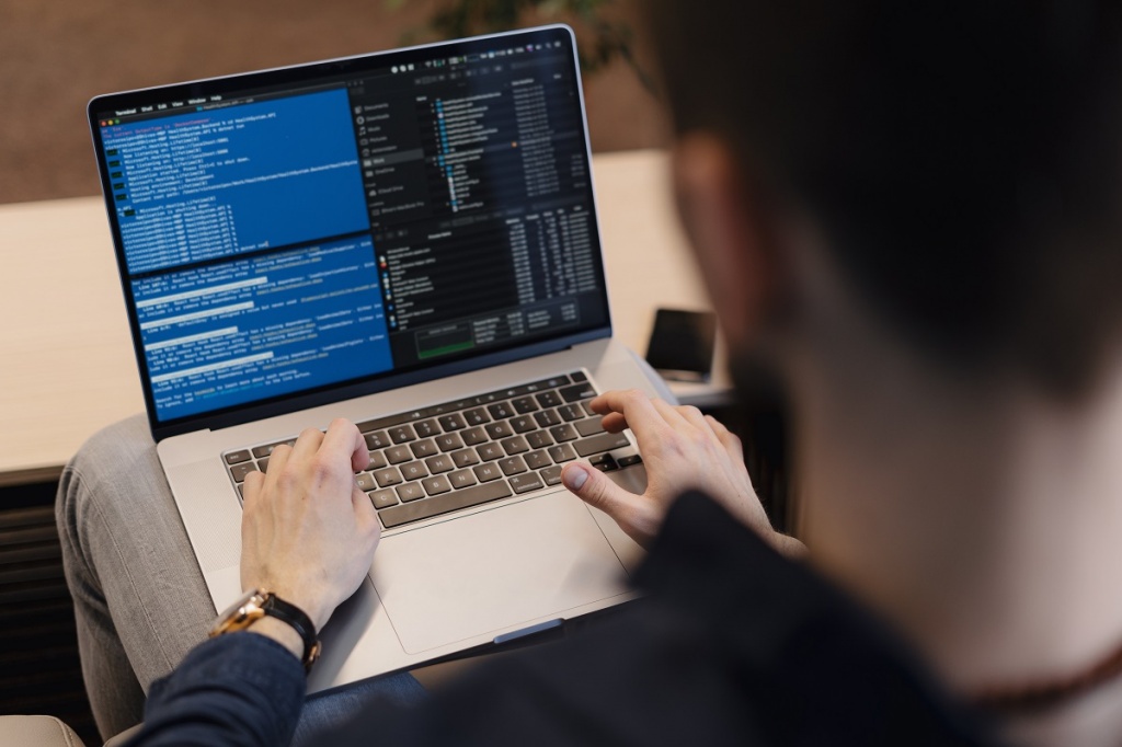 close-up-man-writing-code-laptop.jpg