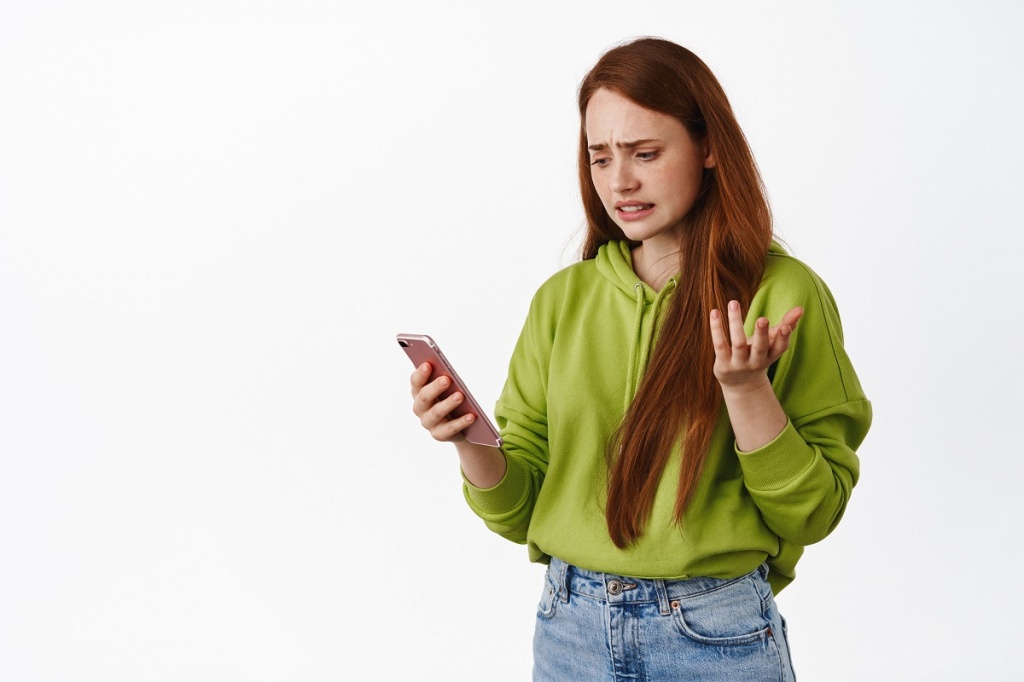 confused-teenage-girl-looking-smartphone-with-puzzled-face-reading-strange-message-app-error-mobile-phone-shrugging-questioned-white-background.jpg