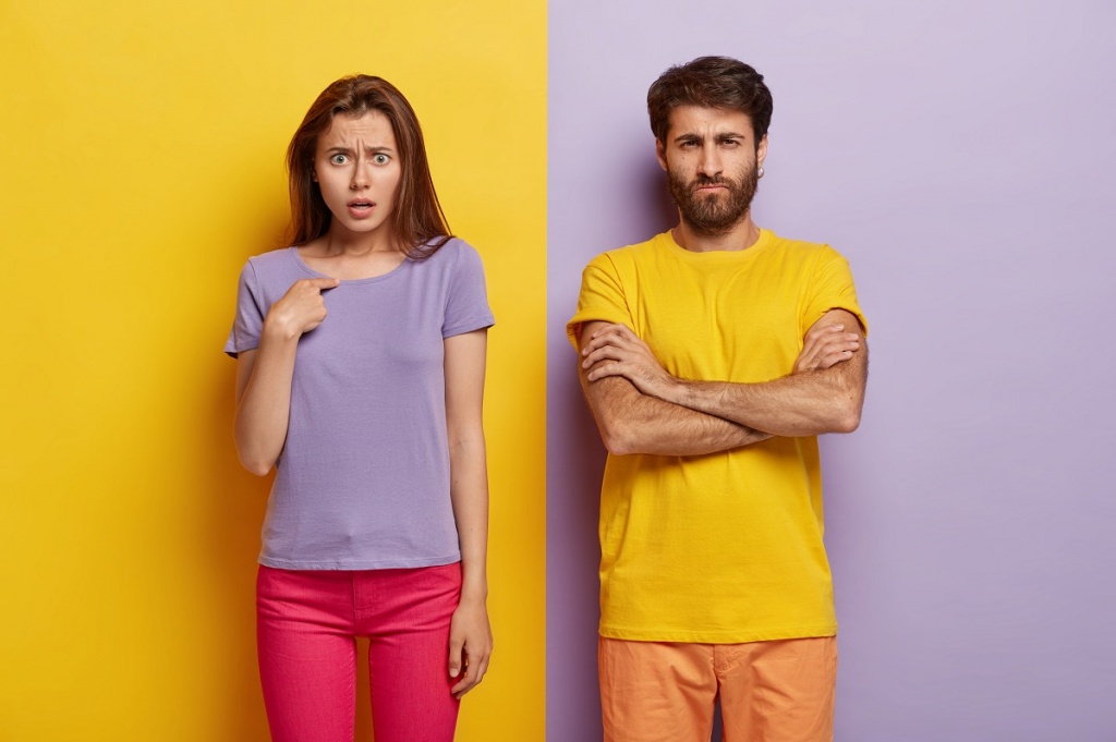 dissatisfied-sullen-unshaven-guy-keeps-arms-folded-indignant-young-woman-points-herself.jpg